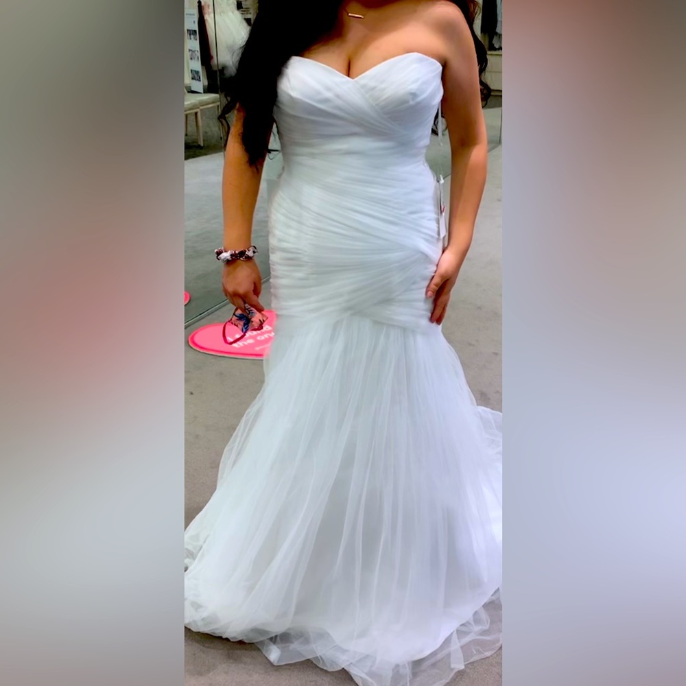 Brand new, never worn, David’s Bridal size 10 wedding dress!